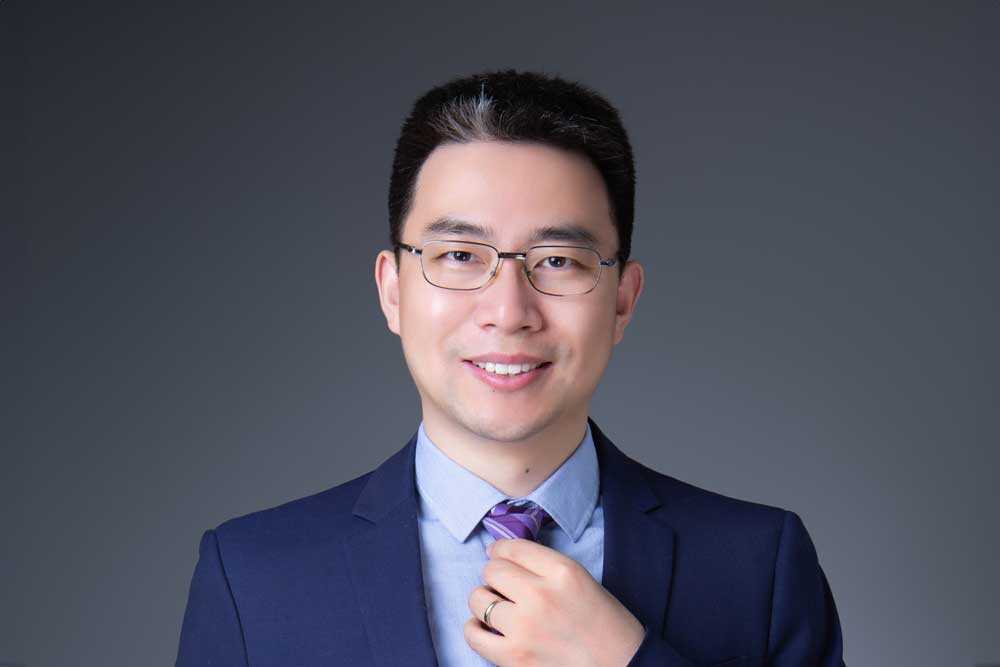 Headshot of Tiger Li, SCOR L&H expert