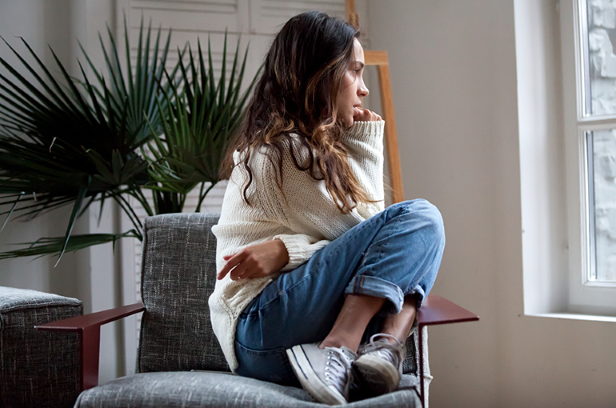 Young woman sitting in chair