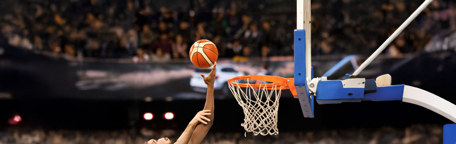 scoring during a basketball game - ball in hoop